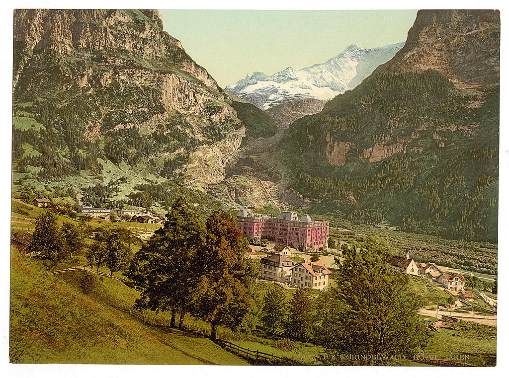A large Victorian hotel set beneath the glacier and peaks at Grindelwald, in a colour photochrom of the 1890s