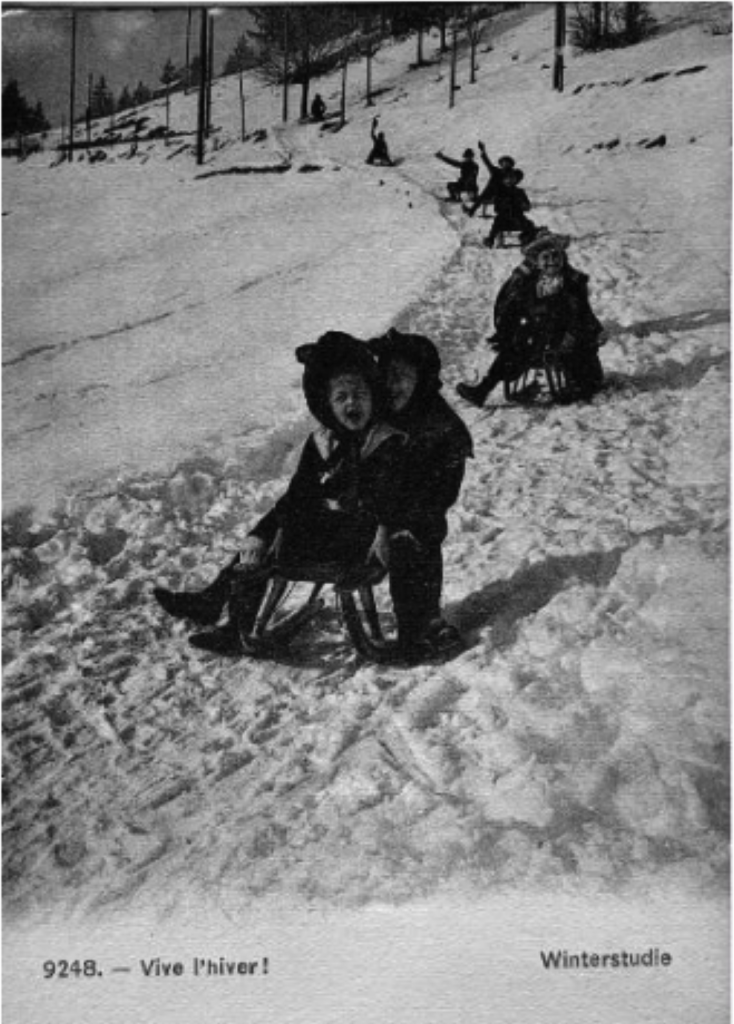 Children sledding in Chateau d'Oex at the turn of the century