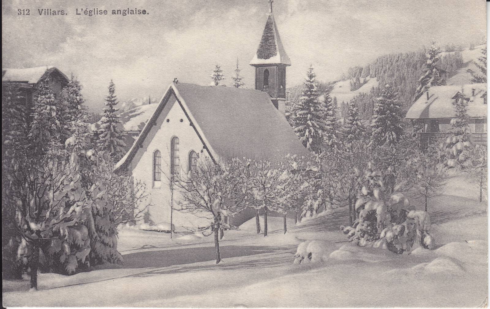The English church at Villars in deep snow, among snow-covered trees, with chalets around it